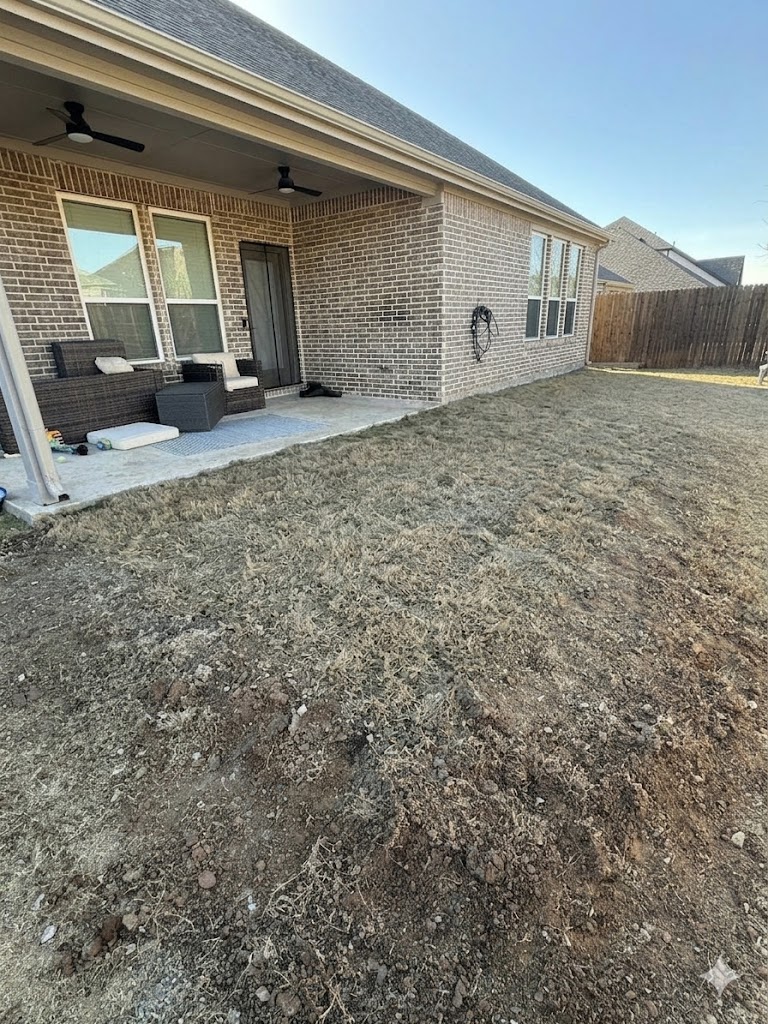 Yard before concrete work by ACS Roofing & Construction